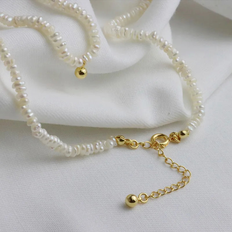 luxurytreasury Very fine freshwater shaped Baroque rice pearl necklace, metal texture clavicle chain, small golden bean pendant